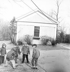 Kids play outside Morewood School